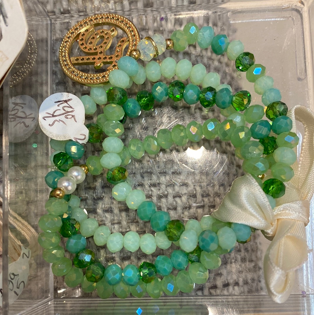 Set pulseras cristales verders + dije Fe con circones