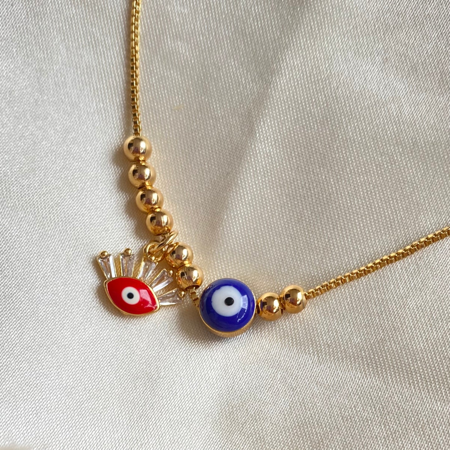 510 Cadenita de balines y ojo turco de rodio ajustable